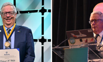A two-panel image shows the same man. On the left, he is smiling and wearing a dark blue suit with a gold medal around his neck, holding a certificate. He stands in front of a light blue and white geometric background. On the right, he is speaking at a podium with a laptop on it, wearing a dark suit and a tie. The podium has "AVIATION" and "21-25 JULY * LAS VEGAS" written on it. Behind him is a large screen with a pink and white logo.